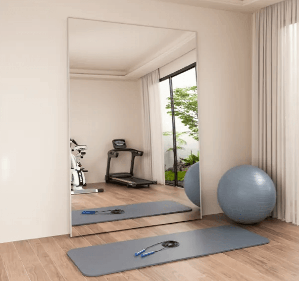 Plumi Wall Mirror standing at home